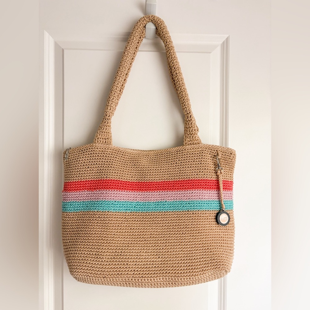 The Sak Woven Casual Classics Tote in a tan color with striped accents